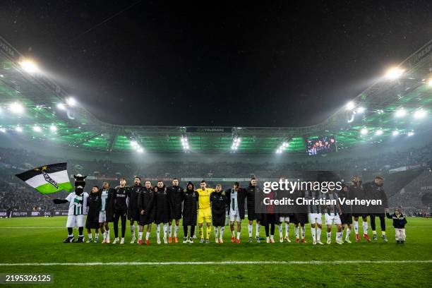 The Team of Borussia Moenchengladbach celebrating with Fans of Borussia Moenchengladbach after the Bundesliga match between Borussia Moenchengladbach...