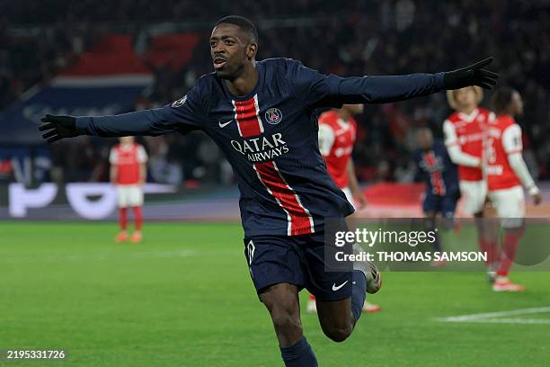 Paris Saint-Germain's French forward Ousmane Dembele celebrates after scoring PSG's first goal during the French L1 football match between Paris...
