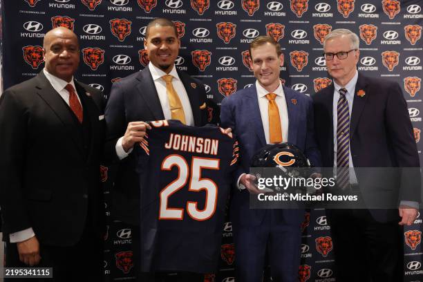 President Kevin Warren, general manager Ryan Poles, newly named head coach Ben Johnson and chairman George McCaskey of the Chicago Bears pose for a...