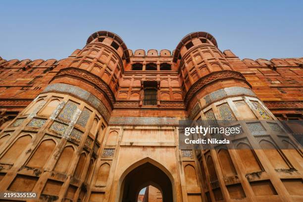 majestic view of agra fort in india captured against clear sky - new delhi stock pictures, royalty-free photos & images