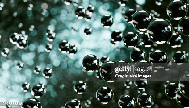 floating soap bubbles creating a beautiful abstract background - air particles stock pictures, royalty-free photos & images