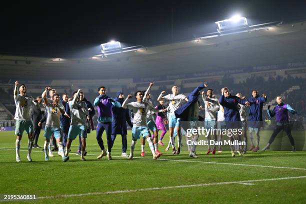 Players of Burnley celebrate in front of their fans after the Sky Bet Championship match between Plymouth Argyle FC and Burnley FC at Home Park on...