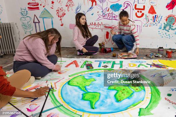 teacher and kids support sustainability - world drawing stock pictures, royalty-free photos & images