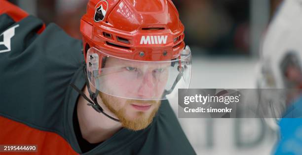 focused caucasian ice hockey player ready for face off - helmet visor stock pictures, royalty-free photos & images