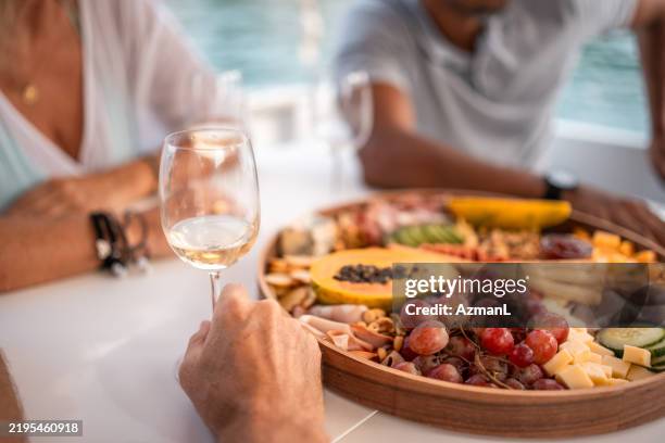 summer cruise dining with wine and fruit - croatia stock pictures, royalty-free photos & images
