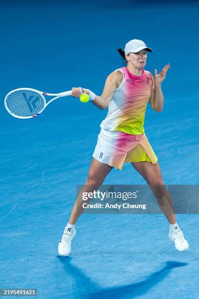 Iga Swiatek of Poland plays a forehand against Madison Keys of the United States in the Women's Singles Semifinal match during day 12 of the 2025...