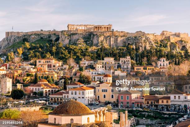 acropolis and plaka historic district on a sunny day, athens, greece - akropolis athen stock-fotos und bilder