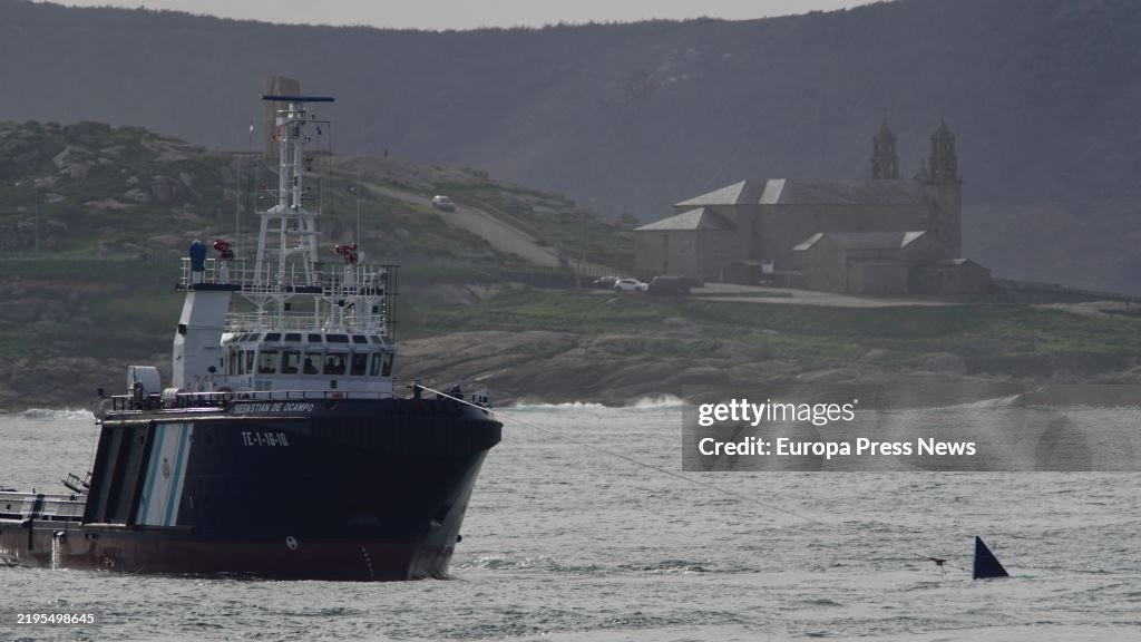 Afloat Workings Civil Guard Maritime Service personnel work for the refloating of a ...
