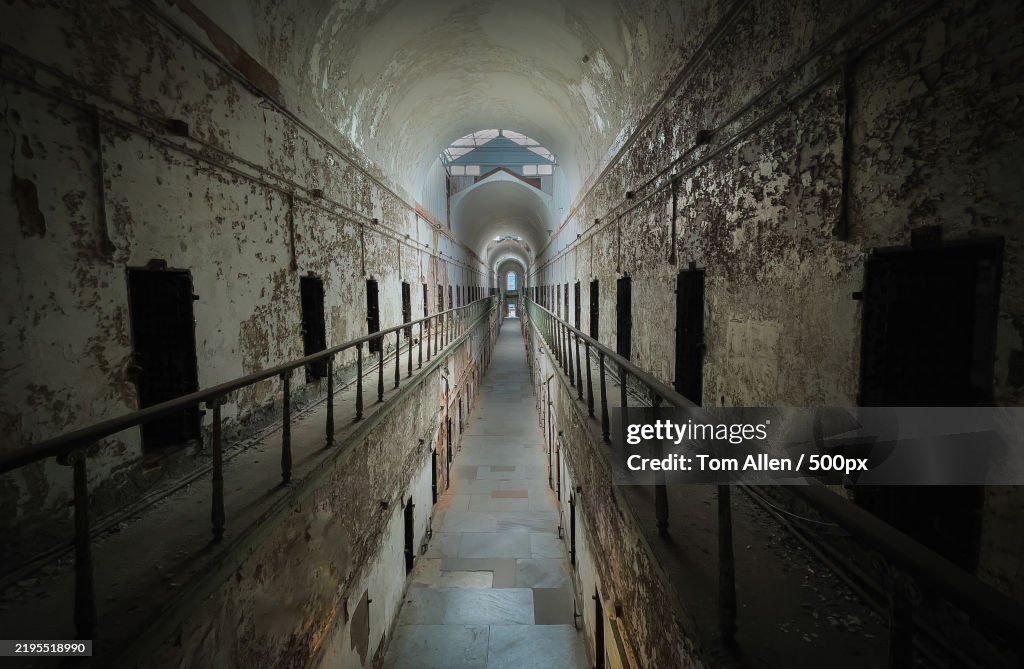 Rear view of people walking in tunnel,Philadelphia,Pennsylvania,United States,USA