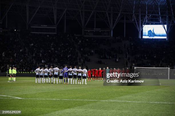 Qarabag FK players and FCSB players during a minute's silence before the match during the UEFA Europa League 2024/25 League Phase MD7 match between...