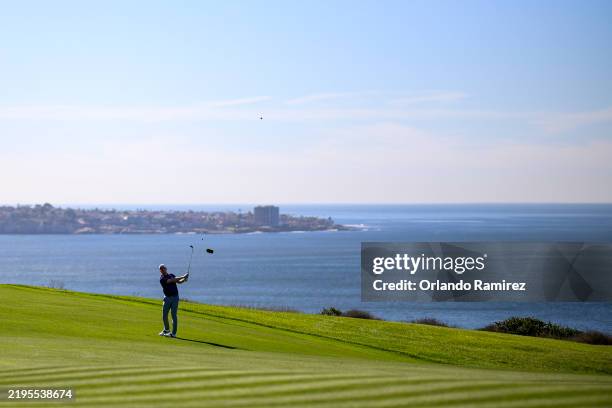 Hayden Springer hits an approach shot on the fourth hole during the second round of the Farmers Insurance Open 2025 at Torrey Pines South Course on...