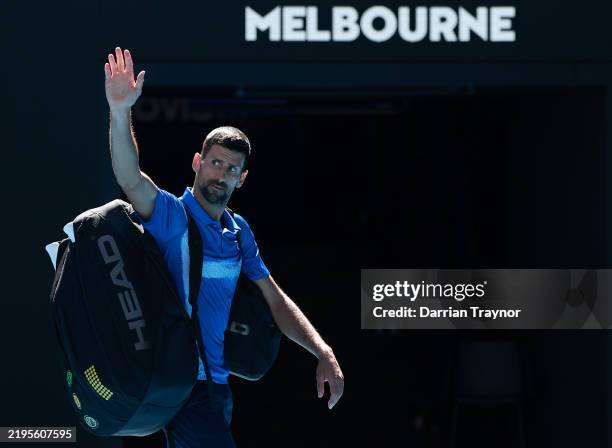Novak Djokovic of Serbia acknowledges the crowd as he leaves the court after retiring from the Men's Singles Semifinal against Alexander Zverev of...