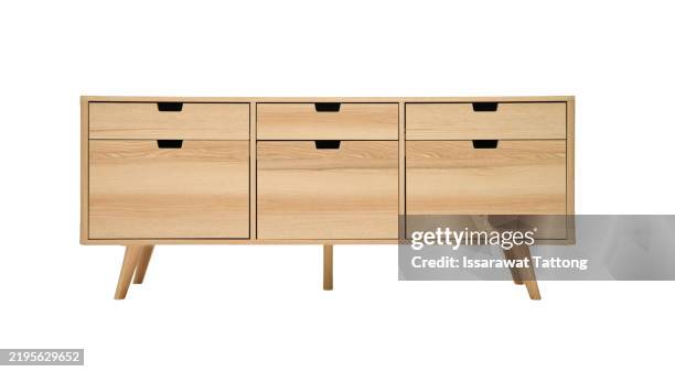a wooden cabinet with three drawers - anrichte stock-fotos und bilder