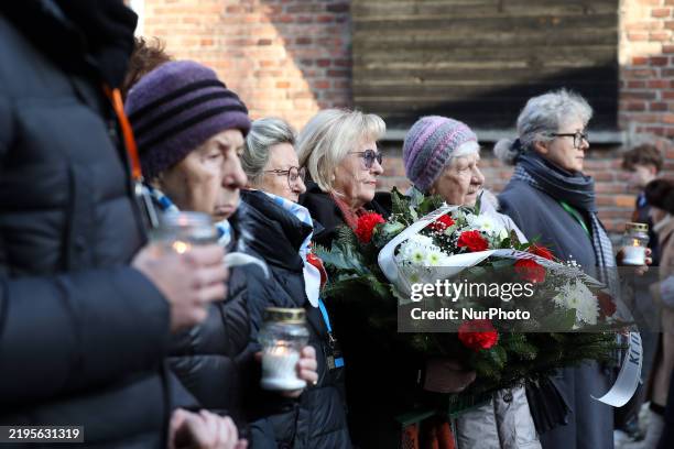In Oswiecim, Poland, on January 27 survivors lay wreaths and candles at the ''Wall of Death'' near block 11 of the former Auschwitz I camp during the...