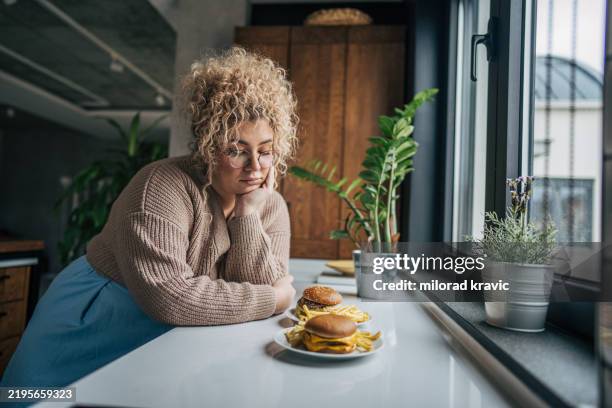 a silent struggle - over eating stock pictures, royalty-free photos & images