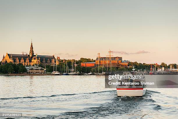 a tourist boat that plies the waters around a big city. - tourboat stock pictures, royalty-free photos & images