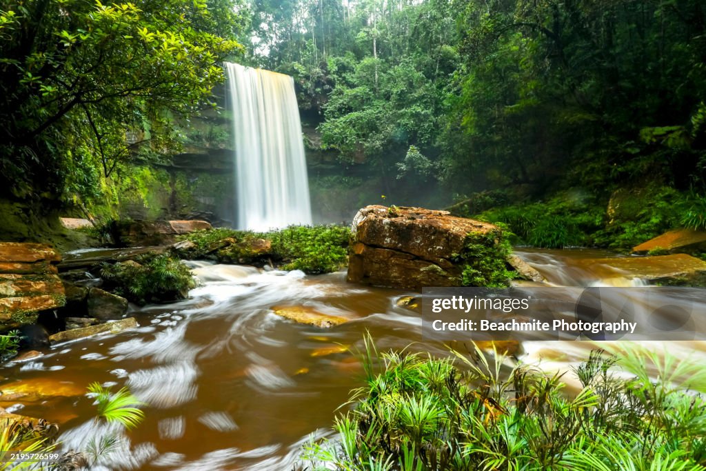 Scenic view of the magnificent Fowzi Waterfall in Maliau Basin Conservation Area in Sabah, Malaysia