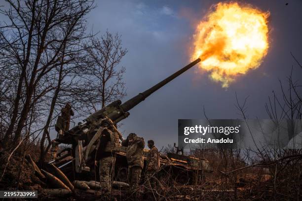 Ukrainian soldiers of 43rd Brigade are seen working on a Soviet era Pion self propelled howitzer in the direction of Chasiv Yar, Ukraine on January...