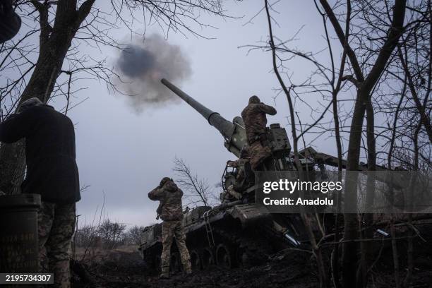 Ukrainian soldiers of 43rd Brigade are seen working on a Soviet era Pion self propelled howitzer in the direction of Chasiv Yar, Ukraine on January...