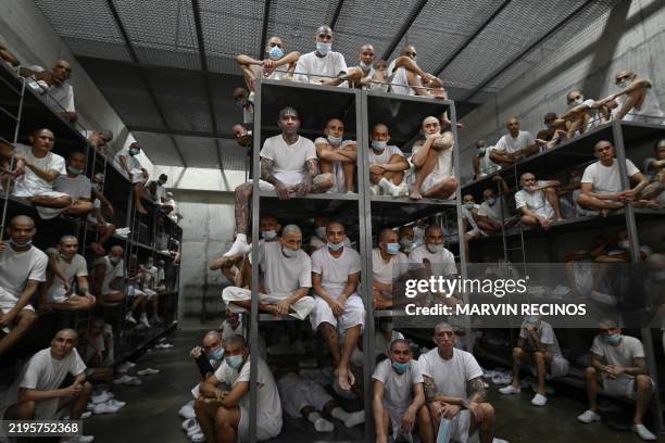 Inmates remain in a cell at the Counter-Terrorism Confinement Centre mega-prison, where hundreds of members of the MS-13 and 18 Street gangs are...