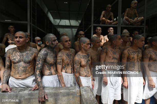 Inmates remain in a cell at the Counter-Terrorism Confinement Centre mega-prison, where hundreds of members of the MS-13 and 18 Street gangs are...