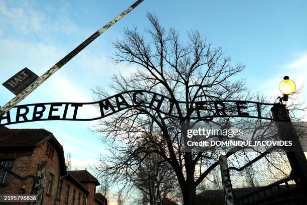 The gate with the lettering in German "Arbeit Macht Frei" is pictured on the sidelines of commemorations on the 80th anniversary of the liberation of...