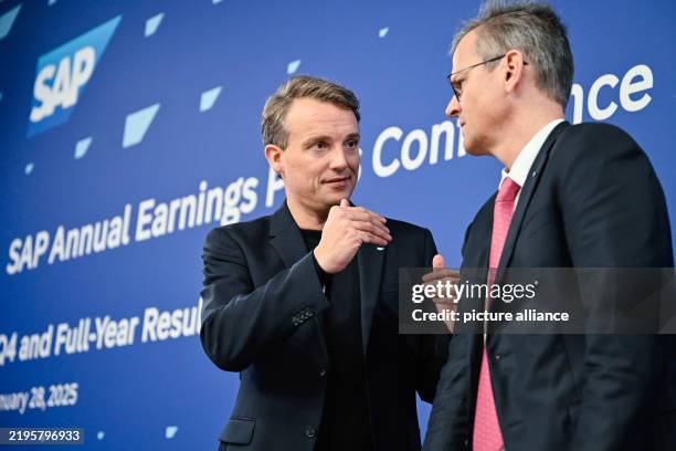 January 2025, Baden-Württemberg, Walldorf: Christian Klein , CEO of the software group SAP, and Dominik Asam, CFO of the software group SAP, stand on...