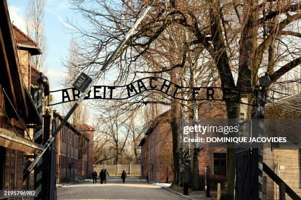 The gate with the lettering in German "Arbeit Macht Frei" is pictured on the sidelines of commemorations on the 80th anniversary of the liberation of...