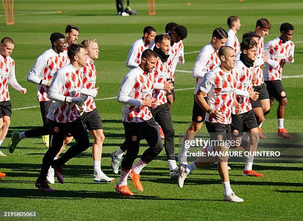 Girona's players attend a training session on the eve of the UEFA Champions League football match between Girona FC and Arsenal FC at the Montilivi...