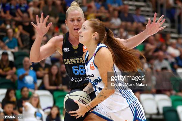 Nolan Stringer Tayah Burrows of the Flyers in action during the round 13 WNBL match ...