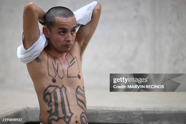 Marvin Medrano sentenced to more than 100 years in prison, shows off his tattoos alluding to Mara Salvatrucha gang during an interview with AFP,...