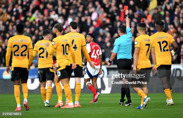 Myles Lewis-Skelly of Arsenal reacts after being shown a red card by Referee Michael Oliver during the Premier League match between Wolverhampton...