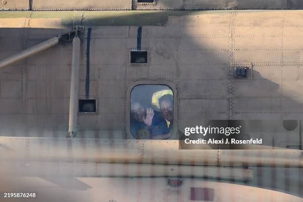 People wave to released hostage Liri Albag as she makes a heart with her hands from the helicopter after arriving at Bellinson hospital on January...