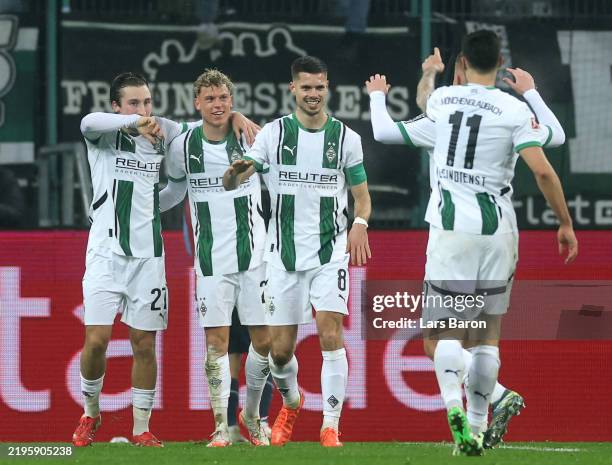 Robin Hack of Borussia Moenchengladbach celebrates scoring his team's second goal with teammates during the Bundesliga match between Borussia...