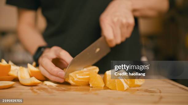 cutting an orange - vitamin c stock pictures, royalty-free photos & images
