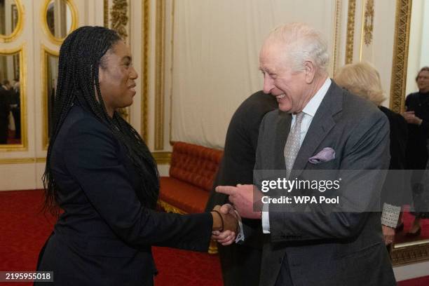 King Charles III with Conservative Party leader Kemi Badenoch during a reception for members of Parliament newly elected in the 2024 election, and...
