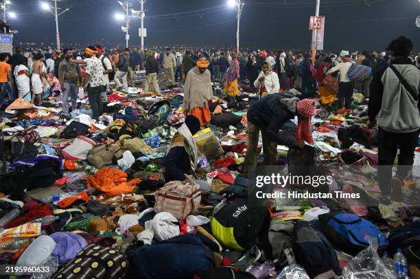 People walk after a deadly stampede before the second Shahi Snan, at Maha Kumbh Mela, on January 29, 2025 in Prayagraj, India. A stampede took place...