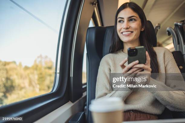 young female tourist rides a train - passagierstrein stockfoto's en -beelden