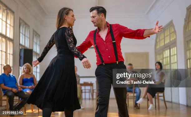 beautiful couple dancing a latin dance tango - tango class stock pictures, royalty-free photos & images