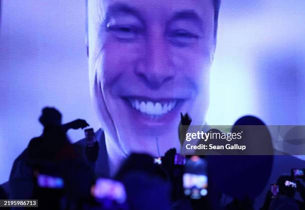 Tech billionaire Elon Musk speaks live via a video transmission during the election campaign launch rally of the far-right Alternative for Germany...
