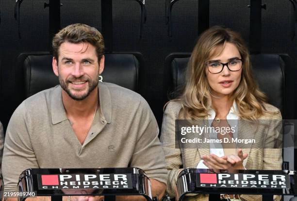 Liam Hemsworth and Gabriella Brooks are seen during the Men's Singles Final between Jannik Sinner of Italy and Alexander Zverev of Germany during day...