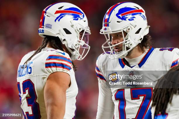 Quarterback Josh Allen of the Buffalo Bills celebrates with wide receiver Mack Hollins after a touchdown during the first half of the AFC...