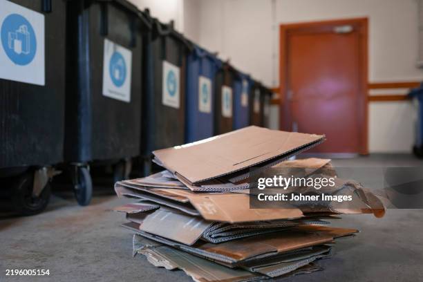 stack of cardboard boxes kept on floor - disposal container stock pictures, royalty-free photos & images