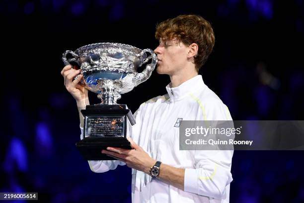 Jannik Sinner of Italy kisses the Norman Brookes Challenge Cup at the Men's Singles trophy presentation following the Men's Singles final against...