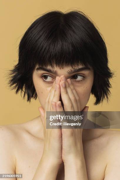 facial expression. fear - woman head in hands crying stock pictures, royalty-free photos & images