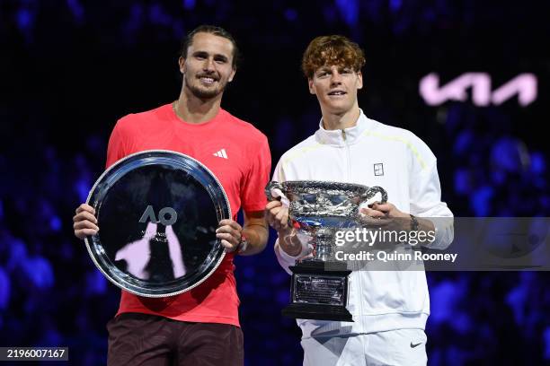 Winner Jannik Sinner of Italy and runner-up Alexander Zverev of Germany pose at the Men's Singles trophy presentation following the Men's Singles...