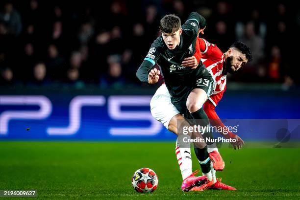 Liverpool FC midfielder James McConnell and PSV Eindhoven midfielder Ismael Saibari play during the match between PSV and Liverpool at the Philips...