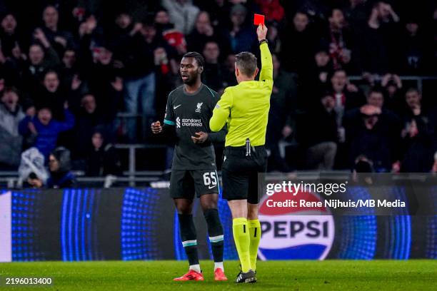 Amara Nallo of Liverpool receives a straight red card from Referee Tobias Stieler during the UEFA Champions League 2024/25 League Phase MD8 match...