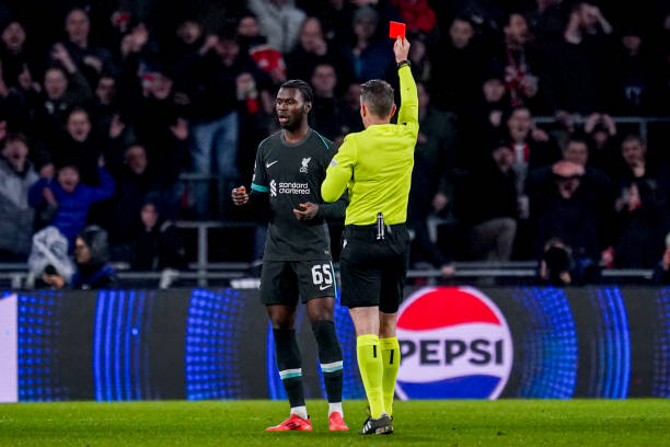 Amara Nallo of Liverpool receives a straight red card from Referee Tobias Stieler during the UEFA Champions League 2024/25 League Phase MD8 match...
