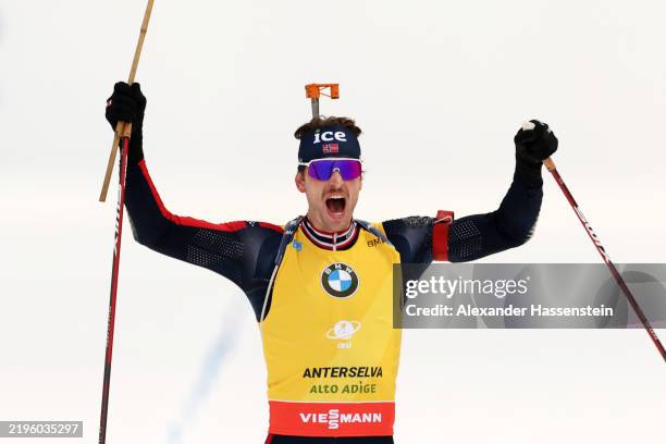 Sturla Holm Lægreid of Norway celebrates as he crosses the finish line to win the Men's 12.5km Pursuit of the IBU World Cup Biathlon Antholz on...